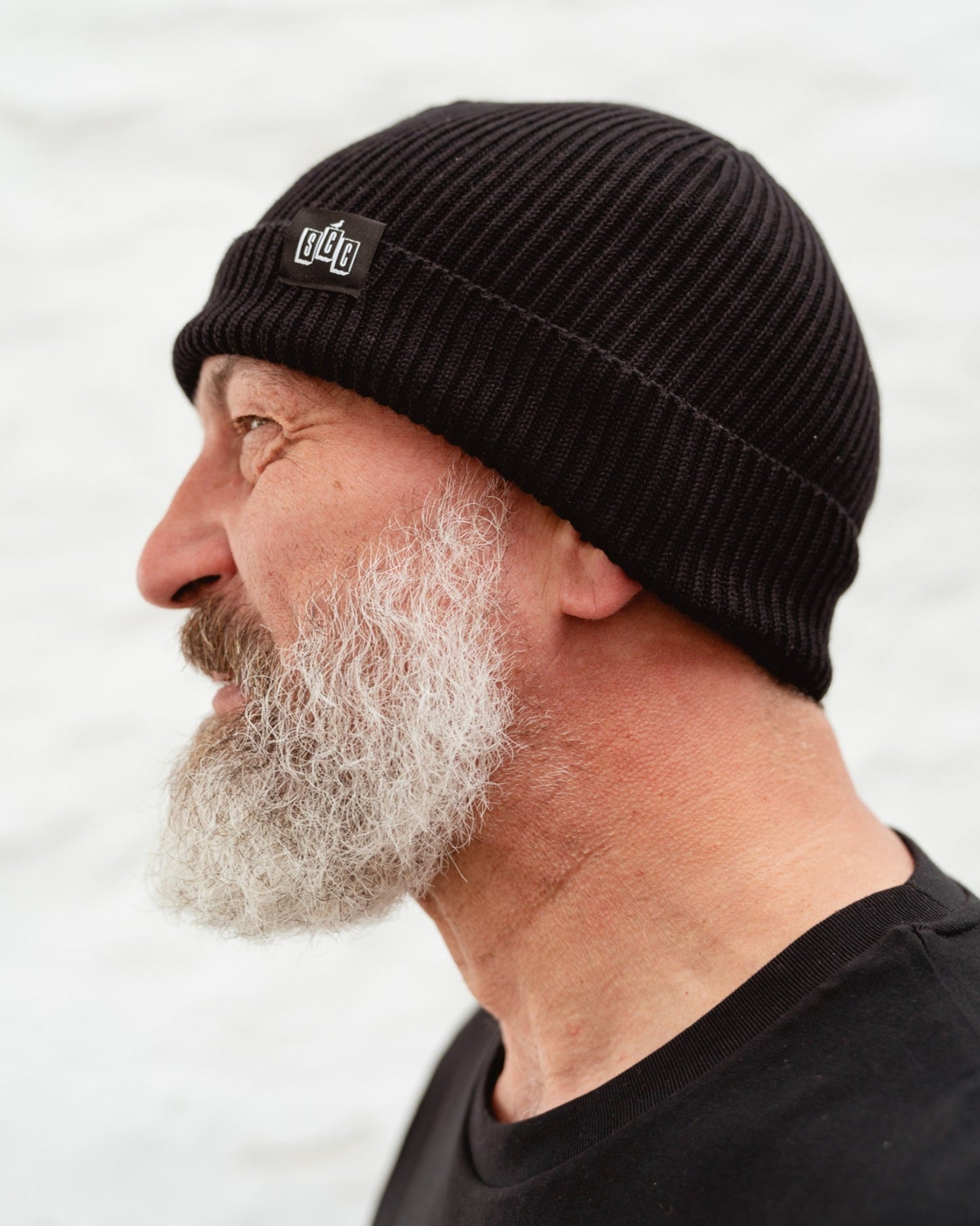 Side view of Surf City Cycles beanie worn by model, highlighting fit and texture, unisex