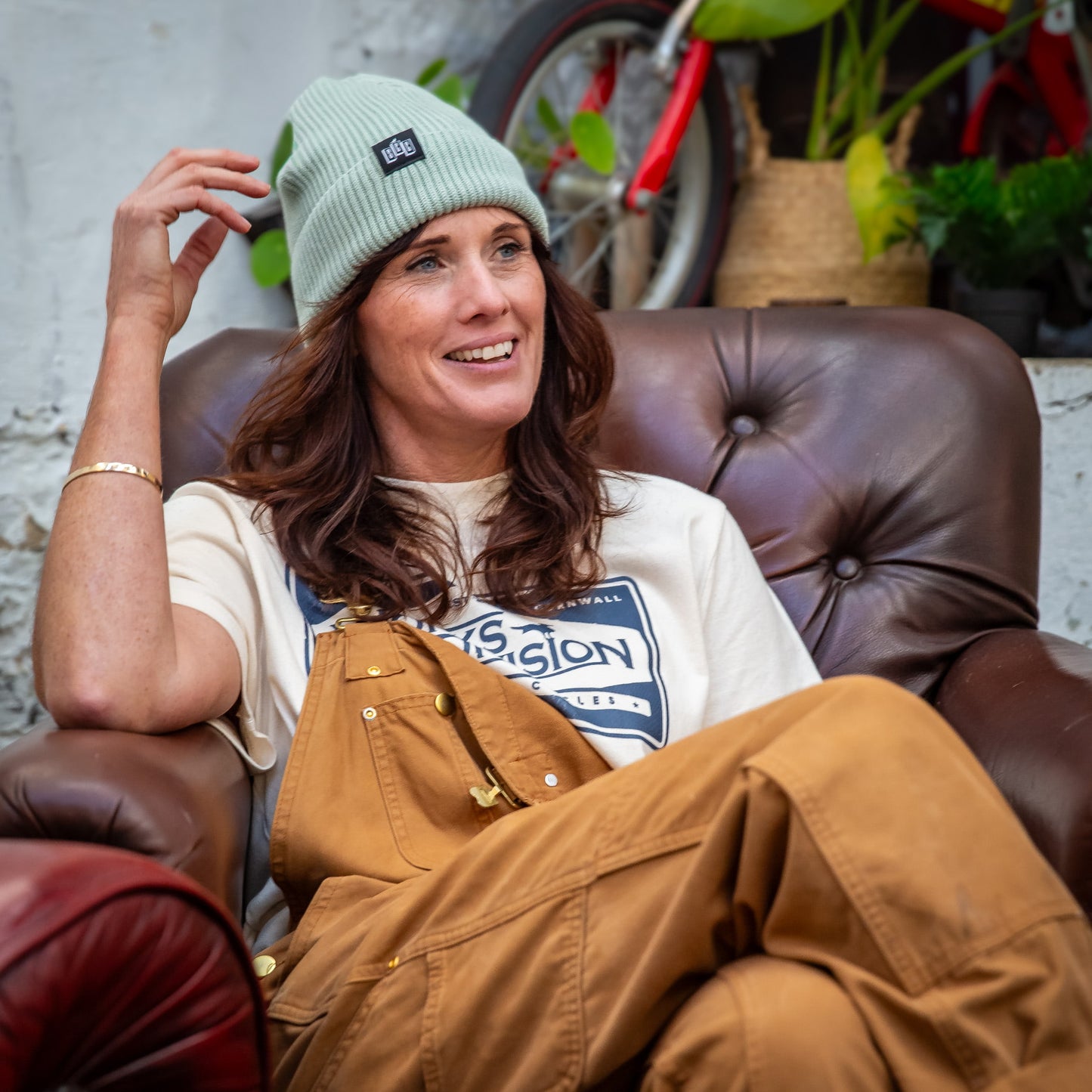 A female model wearing the Seafarer Organic Ribbed Beanie in Seafoam
