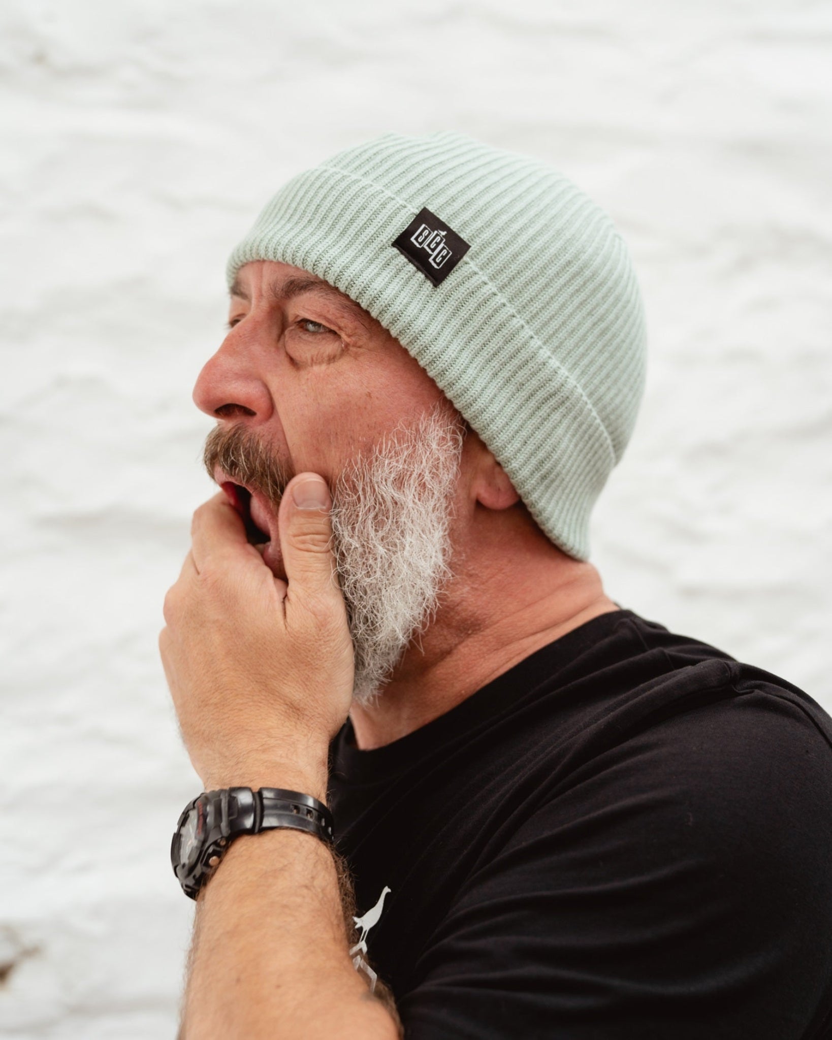 Side view of Surf City Cycles beanie worn by model, highlighting fit and texture, unisex