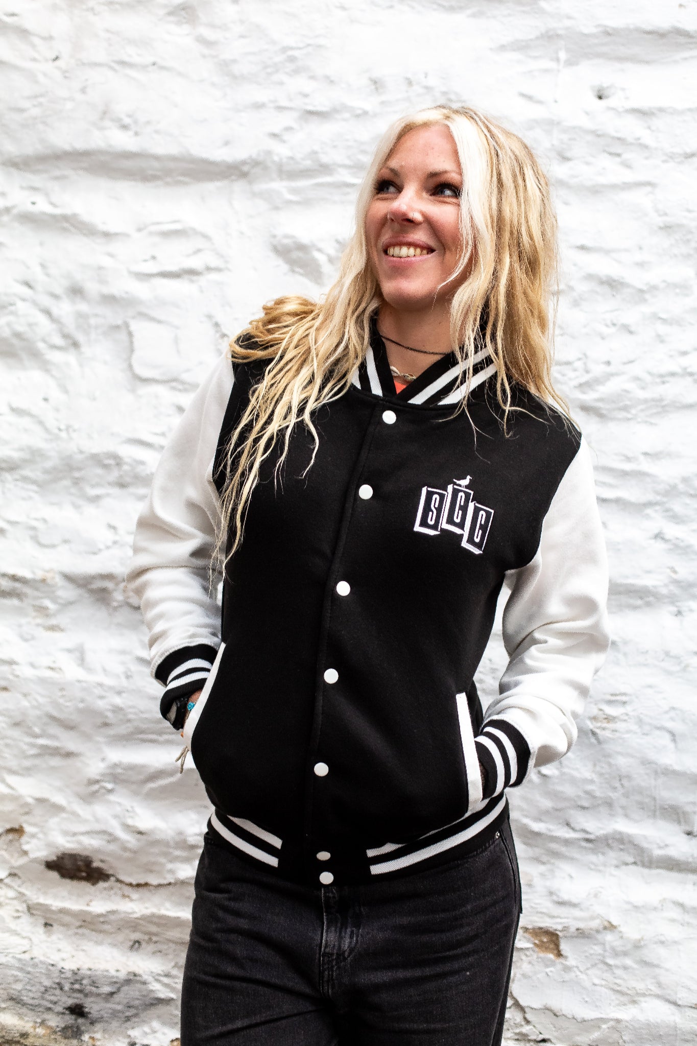 Black and cream varsity jacket by Surf City Cycles, front view, unisex