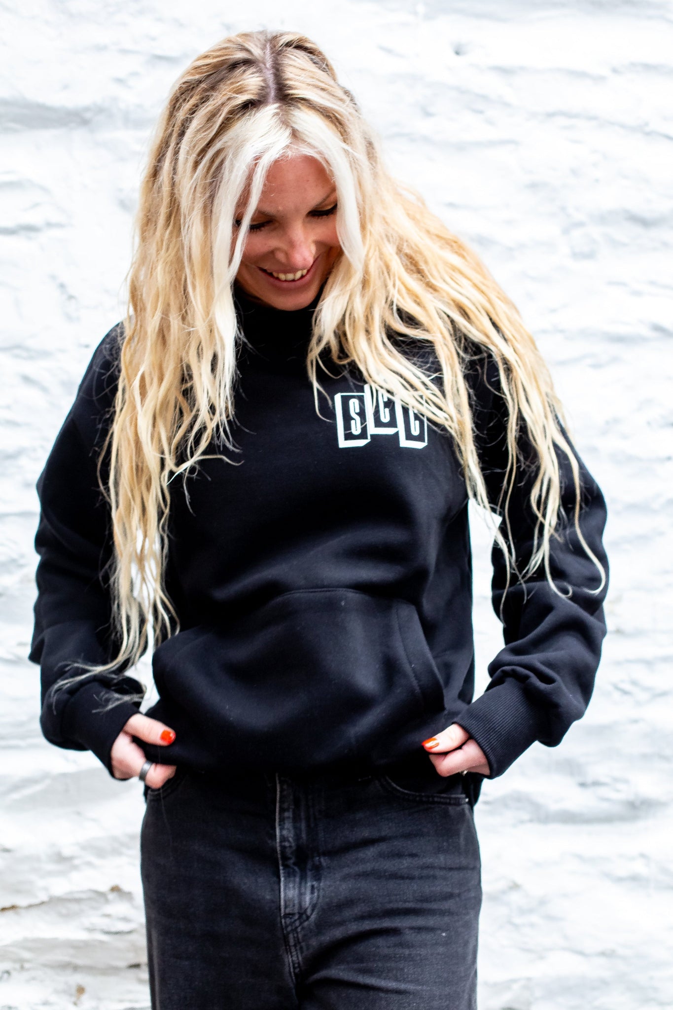 Black pullover hoodie by Surf City Cycles, front view, cotton fleece, unisex