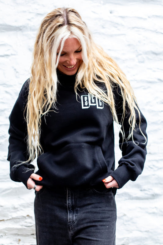 Black pullover hoodie by Surf City Cycles, front view, cotton fleece, unisex