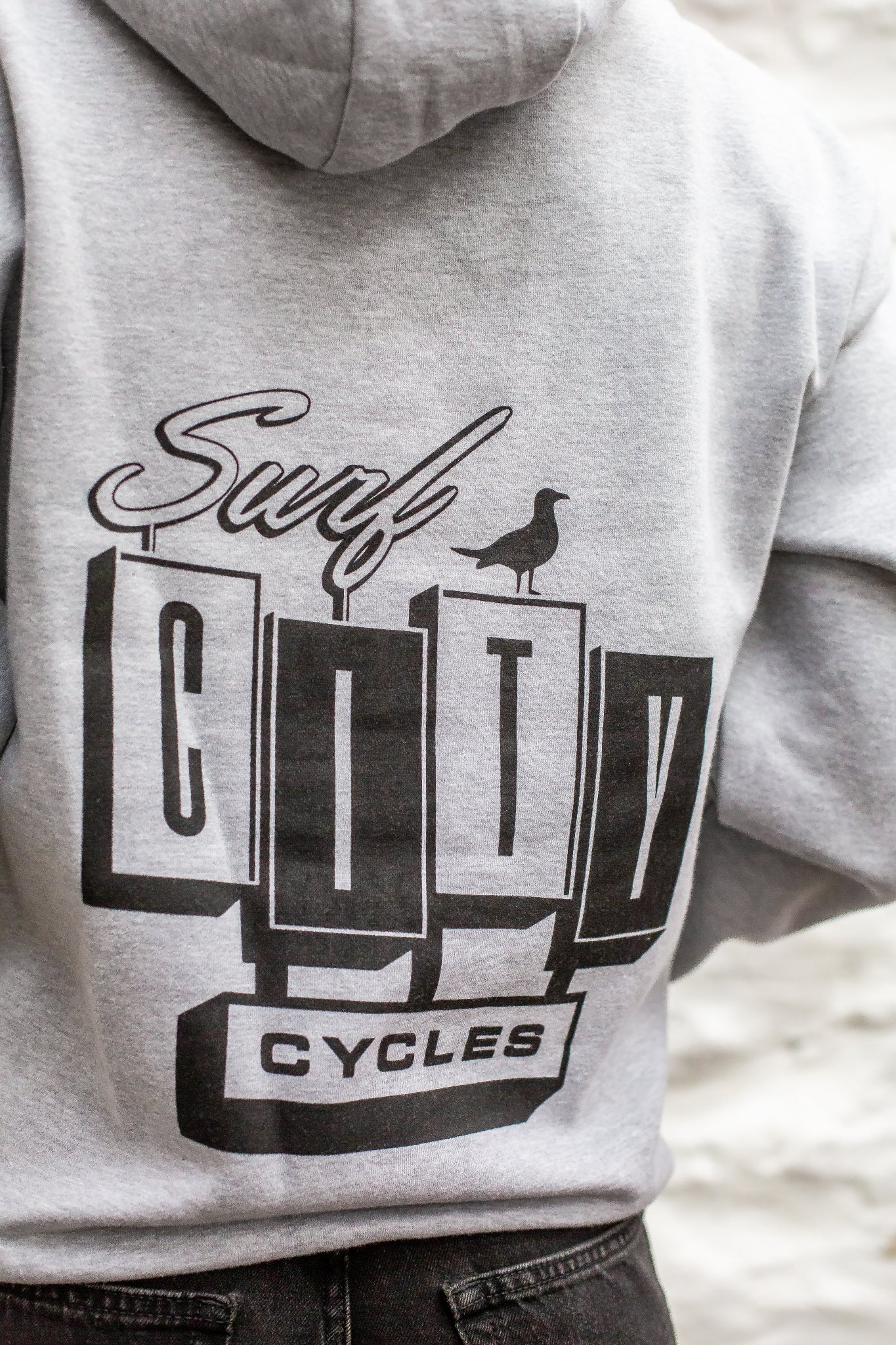 Heather Grey pullover hoodie by Surf City Cycles, close-up of fabric and stitching