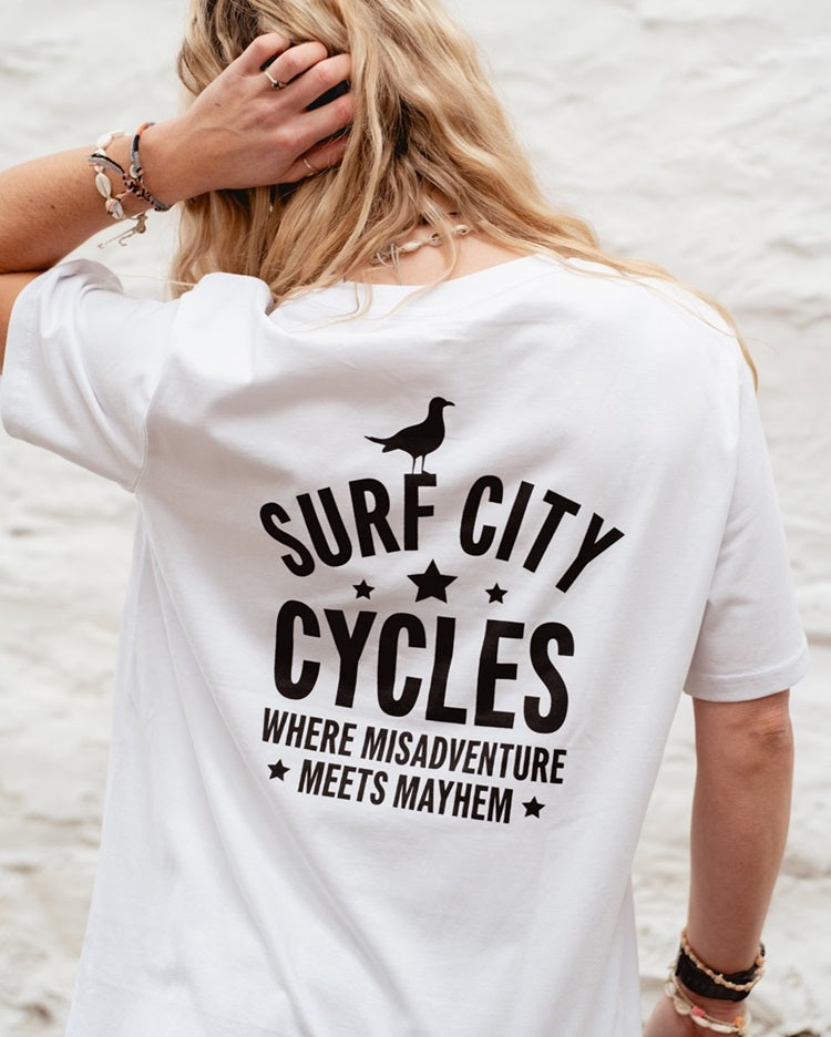 White Surf City Cycles Misadventure T-shirt back view worn by female model