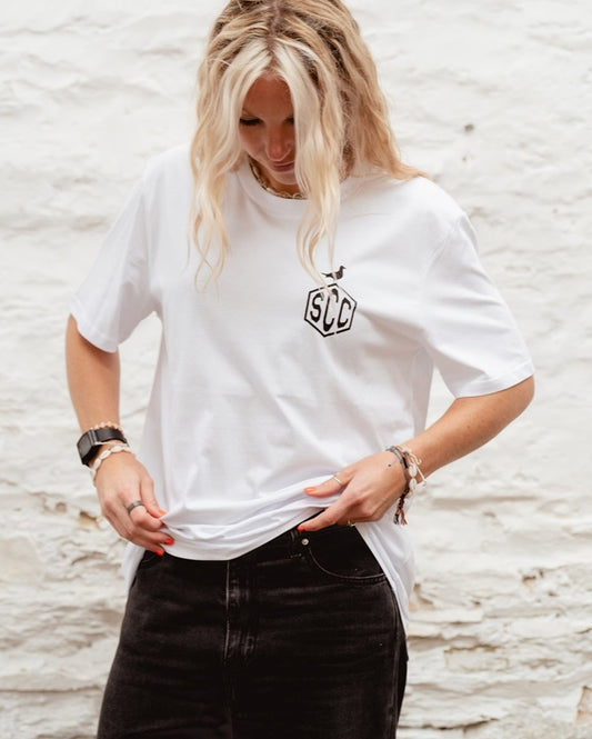 White Surf City Cycles Misadventure T-shirt front view worn by female model