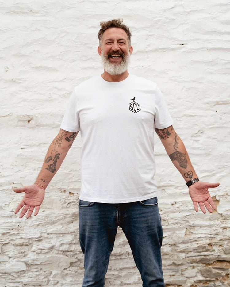 White Surf City Cycles Misadventure T-shirt front view worn by male model